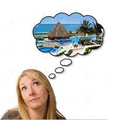 A woman day dreaming about a vacation.
